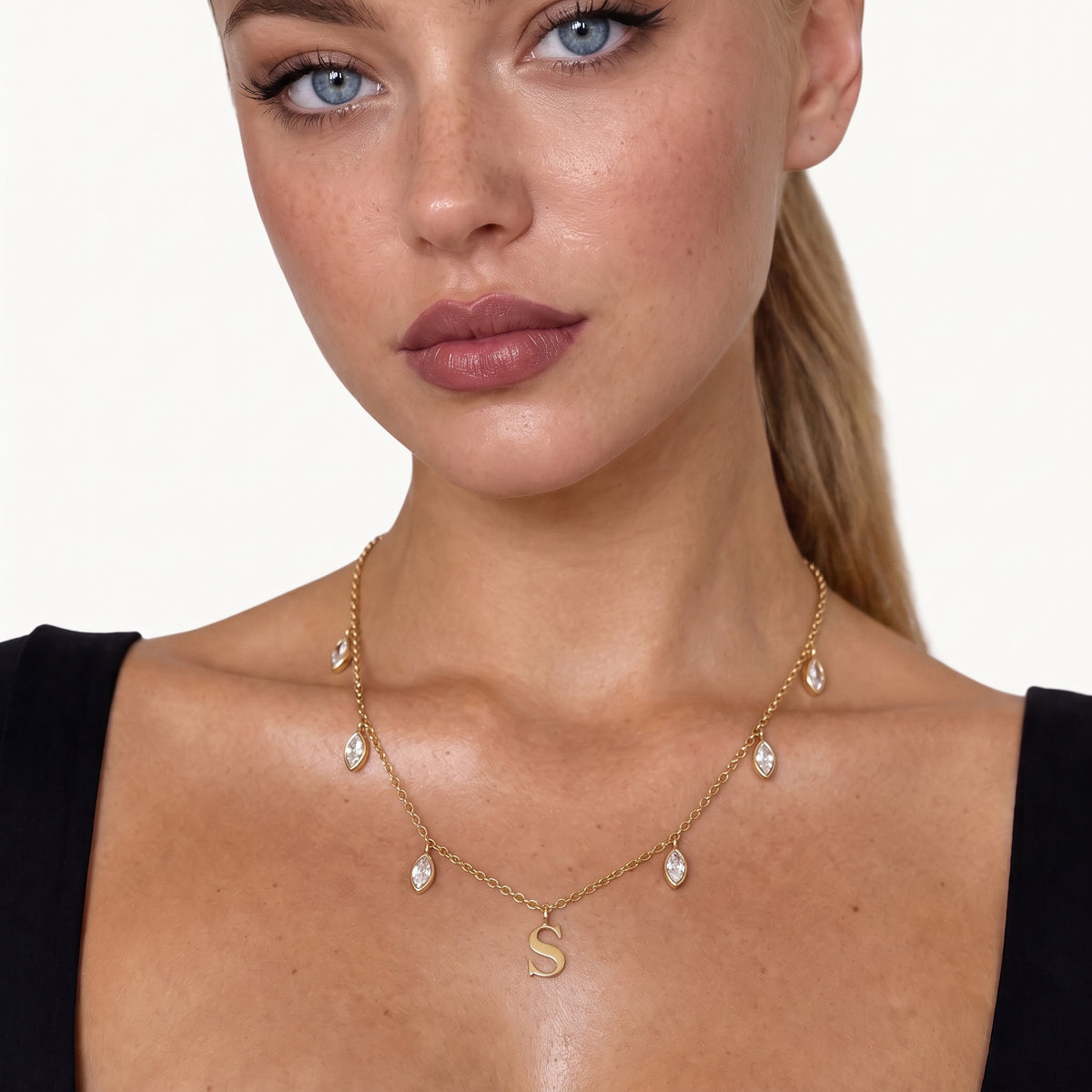 Gold-tone initial necklace with letter pendant and crystal drops