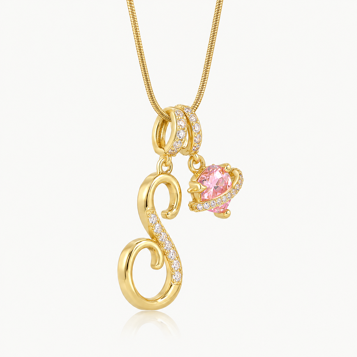 Gold-tone script initial necklace with pink flower charm