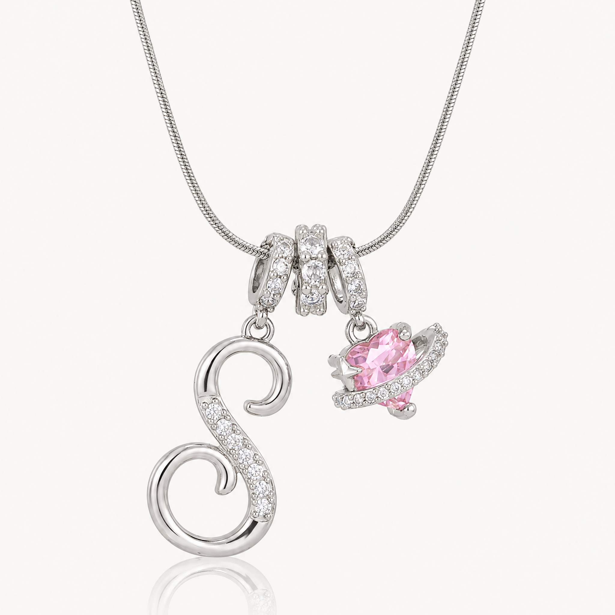 Silver-tone script initial necklace with pink flower charm