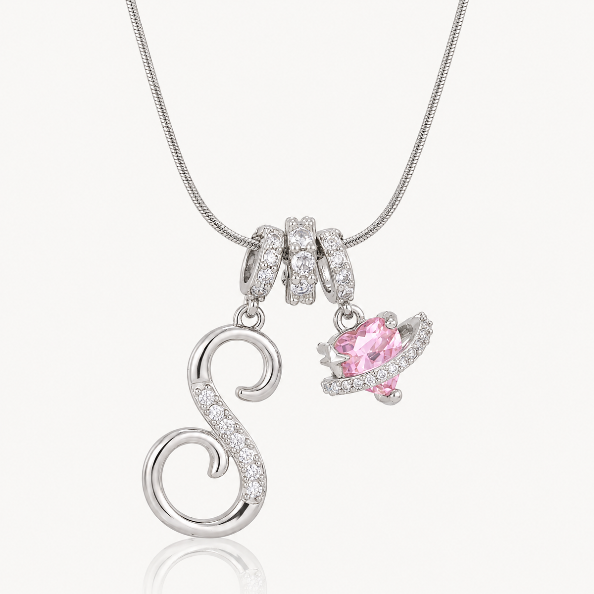Silver-tone script initial necklace with pink flower charm