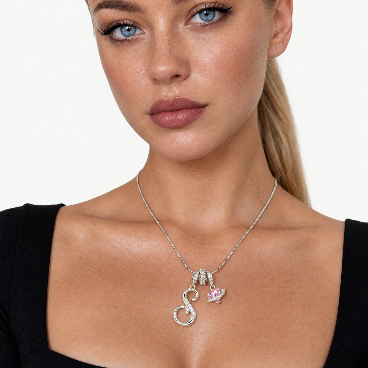 Silver-tone script initial necklace with pink flower charm