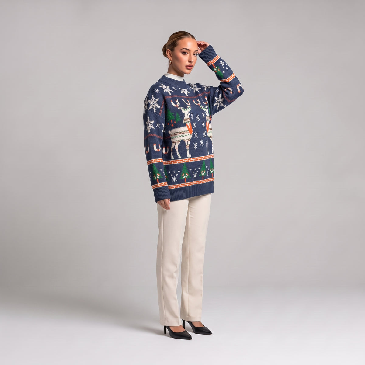 Navy reindeer jumper, three quarter view on model