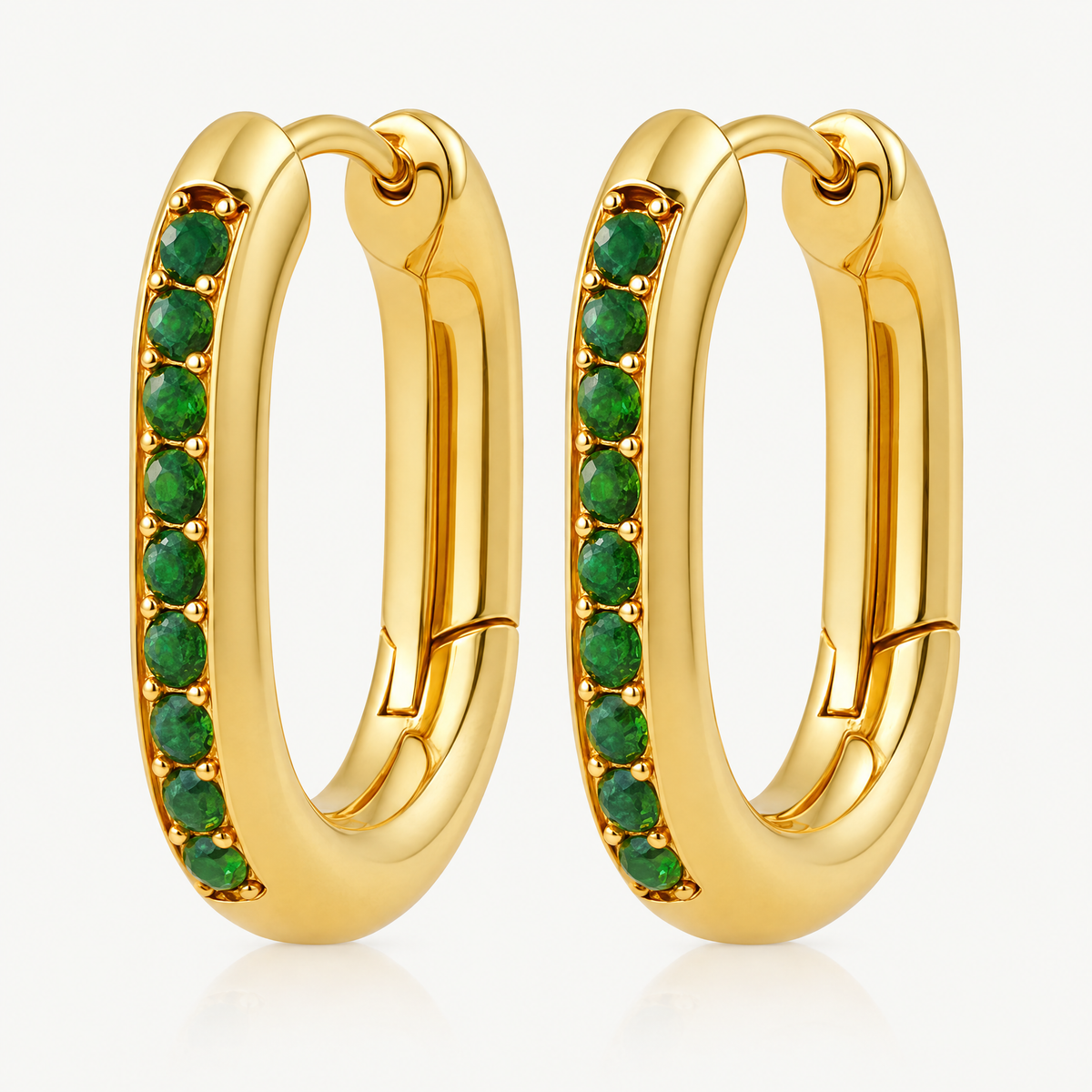 Pair of gold-tone oval huggie hoop earrings with green stones
