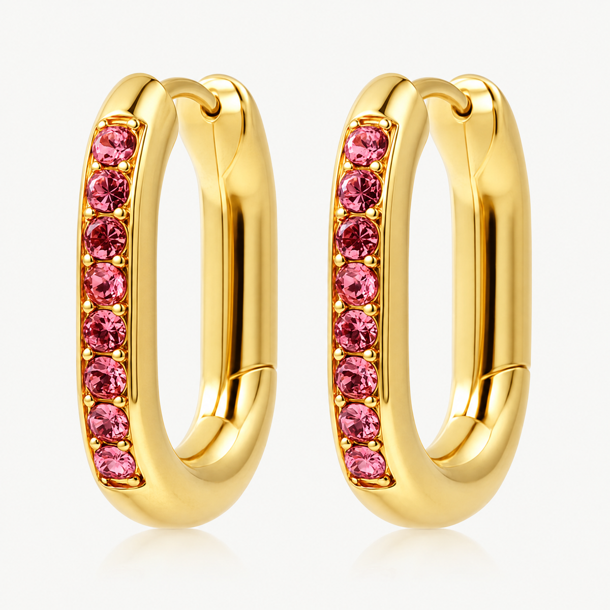 Pair of gold-tone oval huggie hoop earrings with pink stones