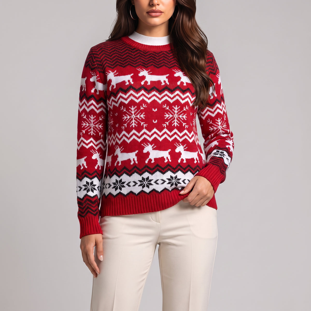 Close-up of red knit jumper with white reindeer, zigzag and snowflake rows