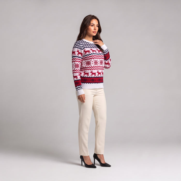 White reindeer Christmas jumper side view, worn with cream trousers