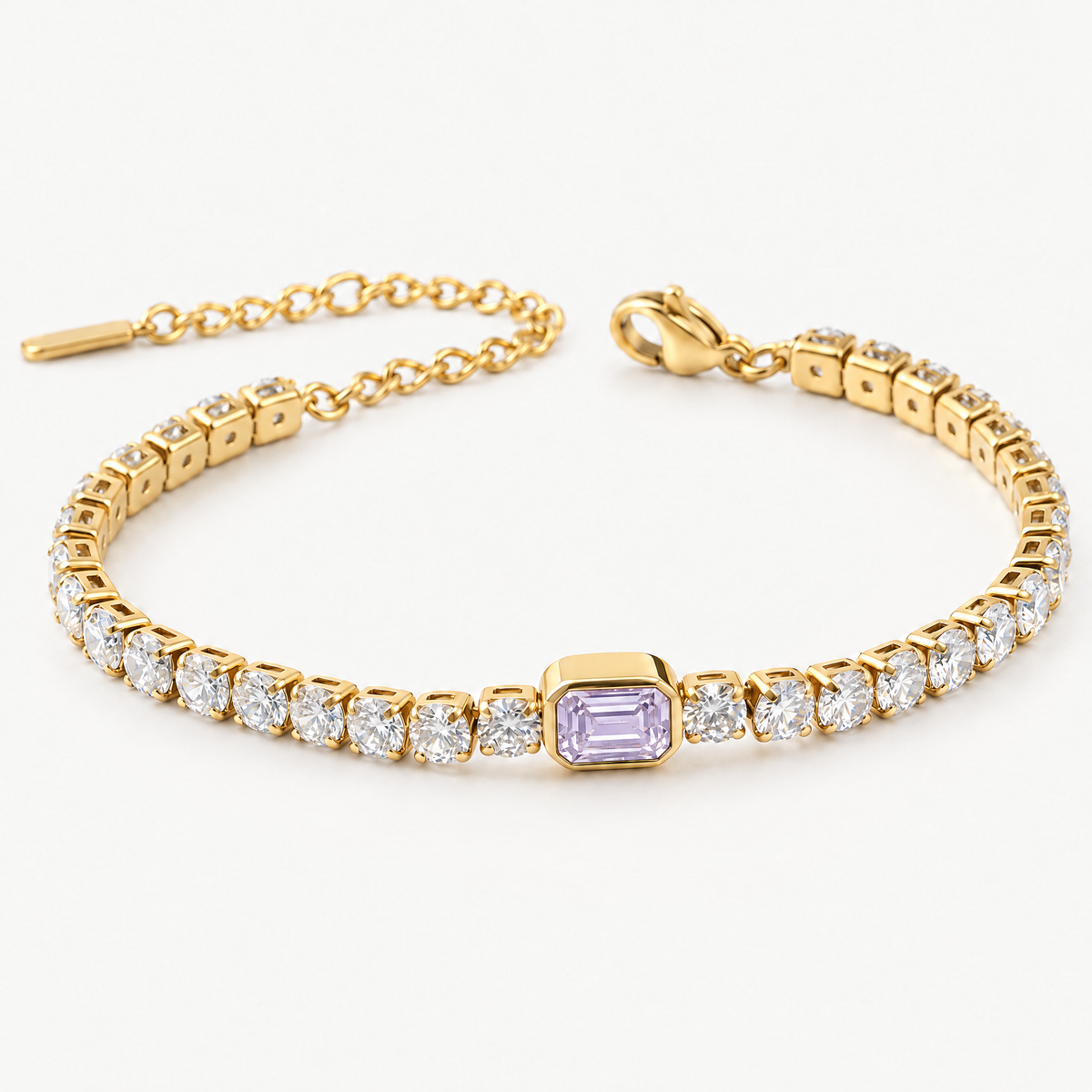 Gold-tone tennis bracelet with a purple emerald-cut centre stone, angled view