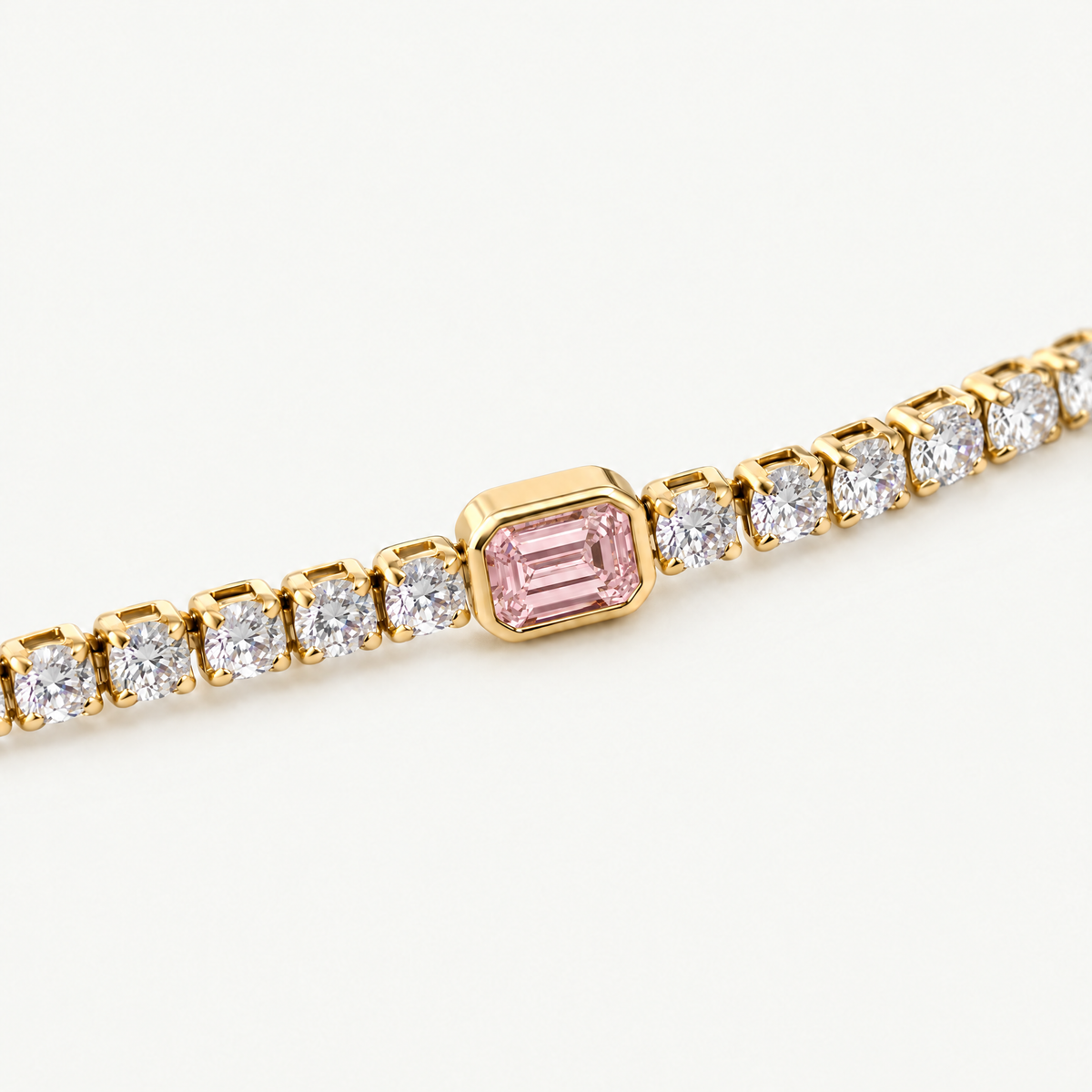 Close up of the pink emerald-cut centre stone in its smooth bezel