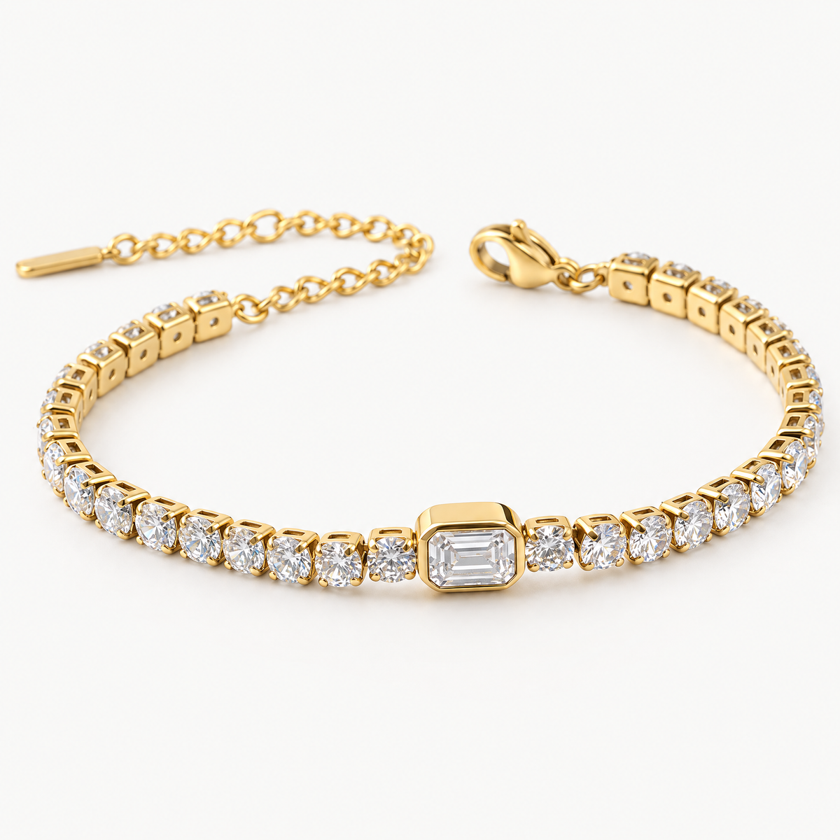 Gold-tone tennis bracelet with an emerald-cut centre stone, angled view