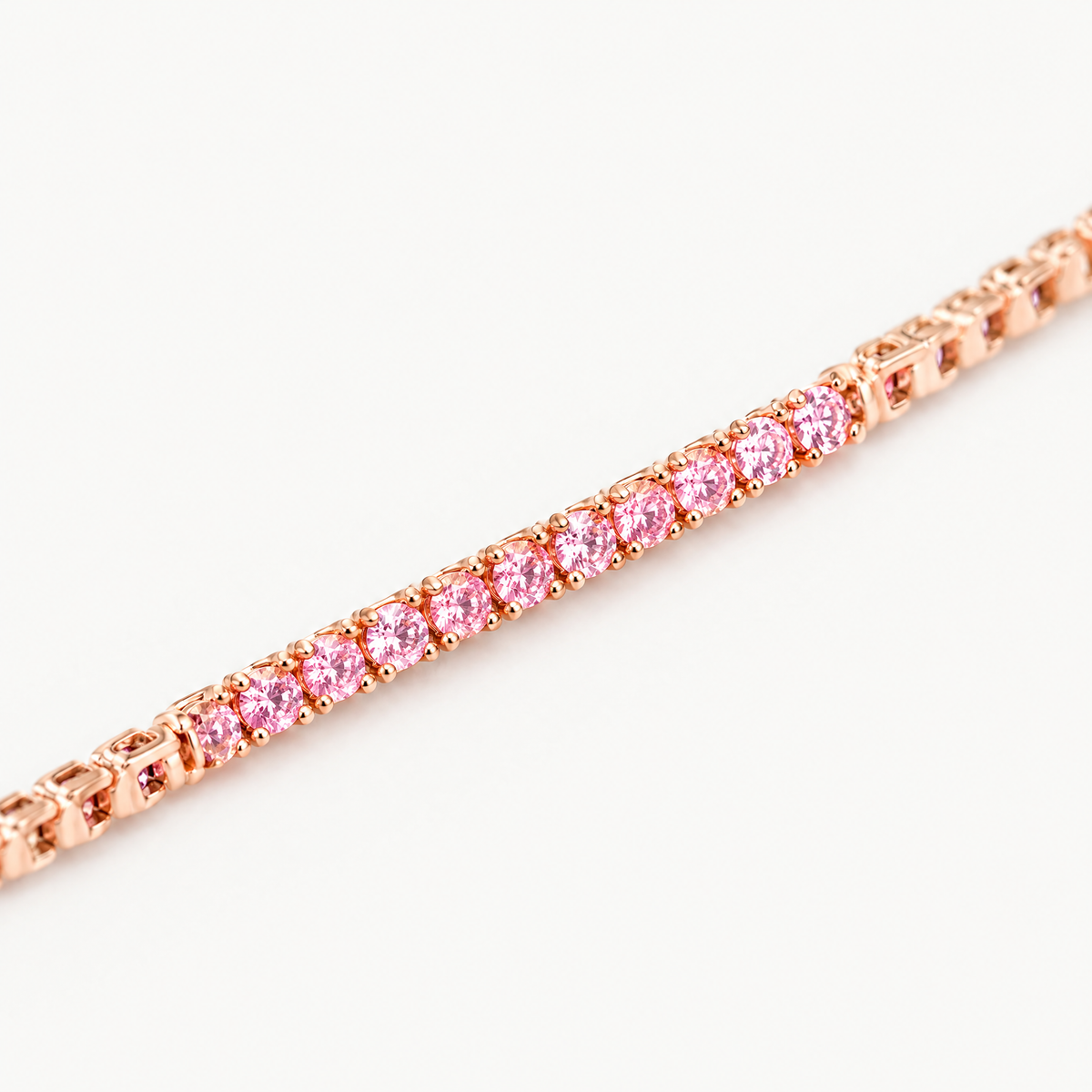 Close up of the four-prong settings of the rose gold plated tennis bracelet