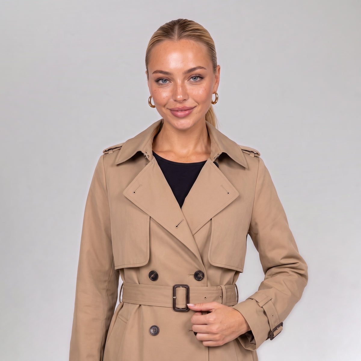 Close up of the khaki double breasted trench coat with belt
