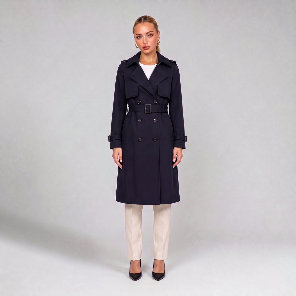 Navy double breasted trench coat with belt, front view on model