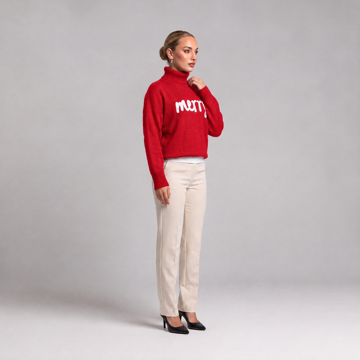 Red merry roll neck Christmas jumper, side view on model