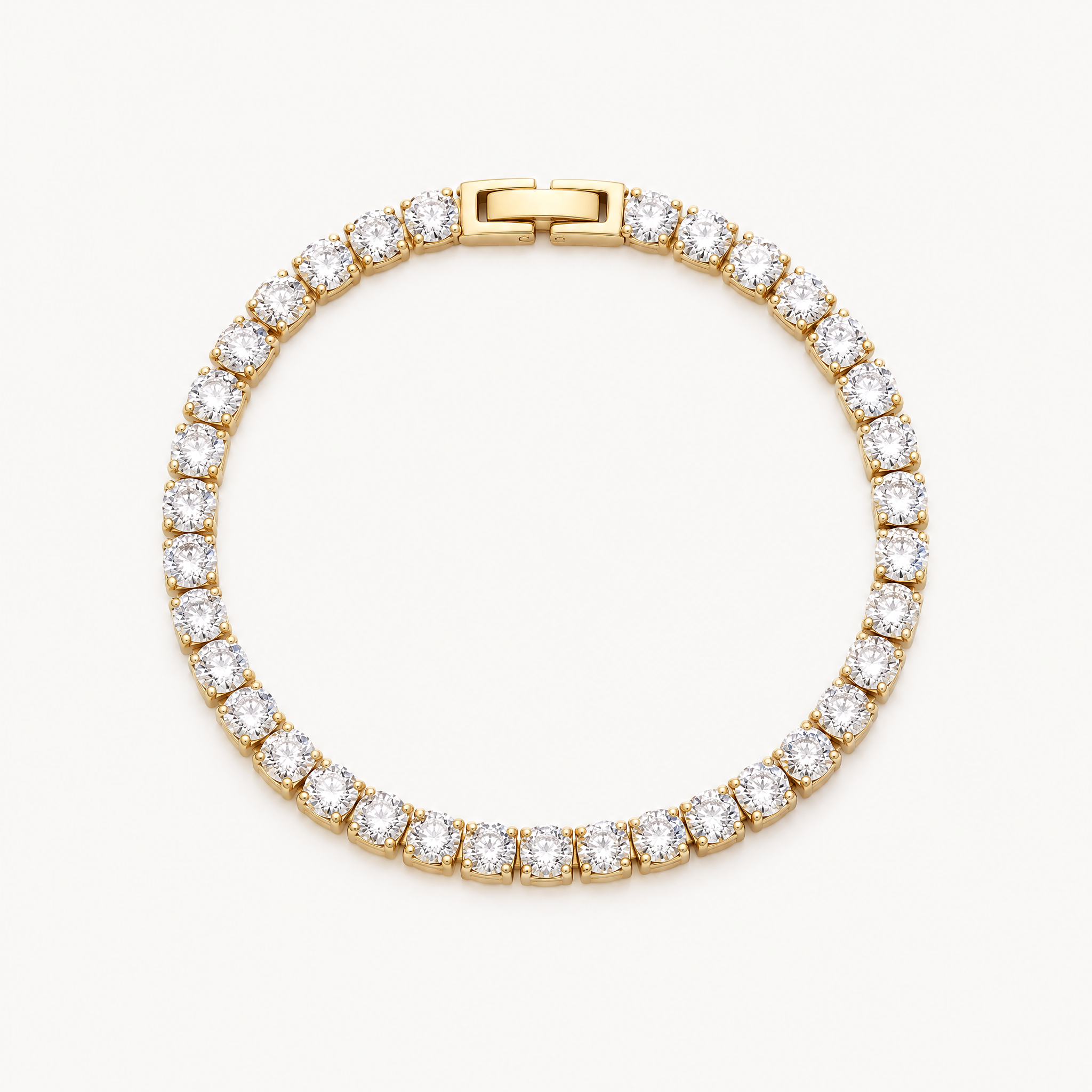 Gold-tone tennis bracelet with a single row of round cubic zirconia stones
