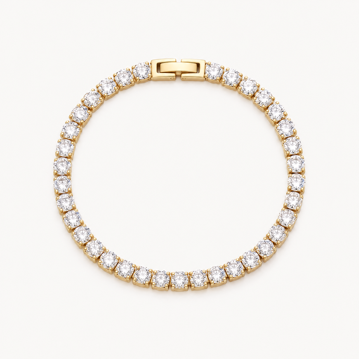 Gold-tone tennis bracelet with a single row of round cubic zirconia stones