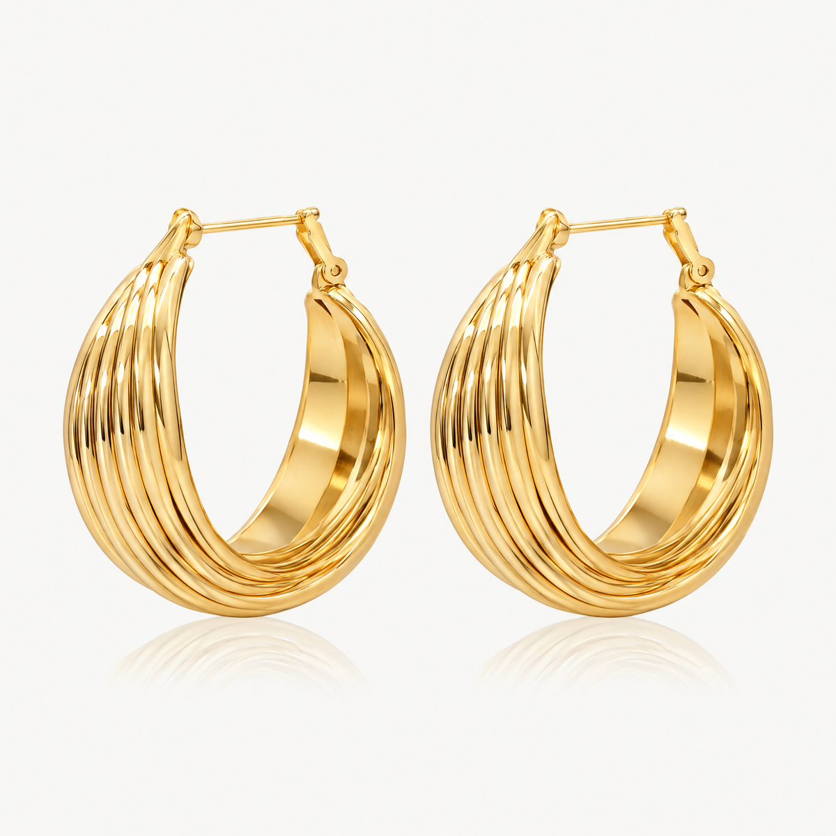 Pair of gold-tone chunky hoop earrings made of layered ribbed bands