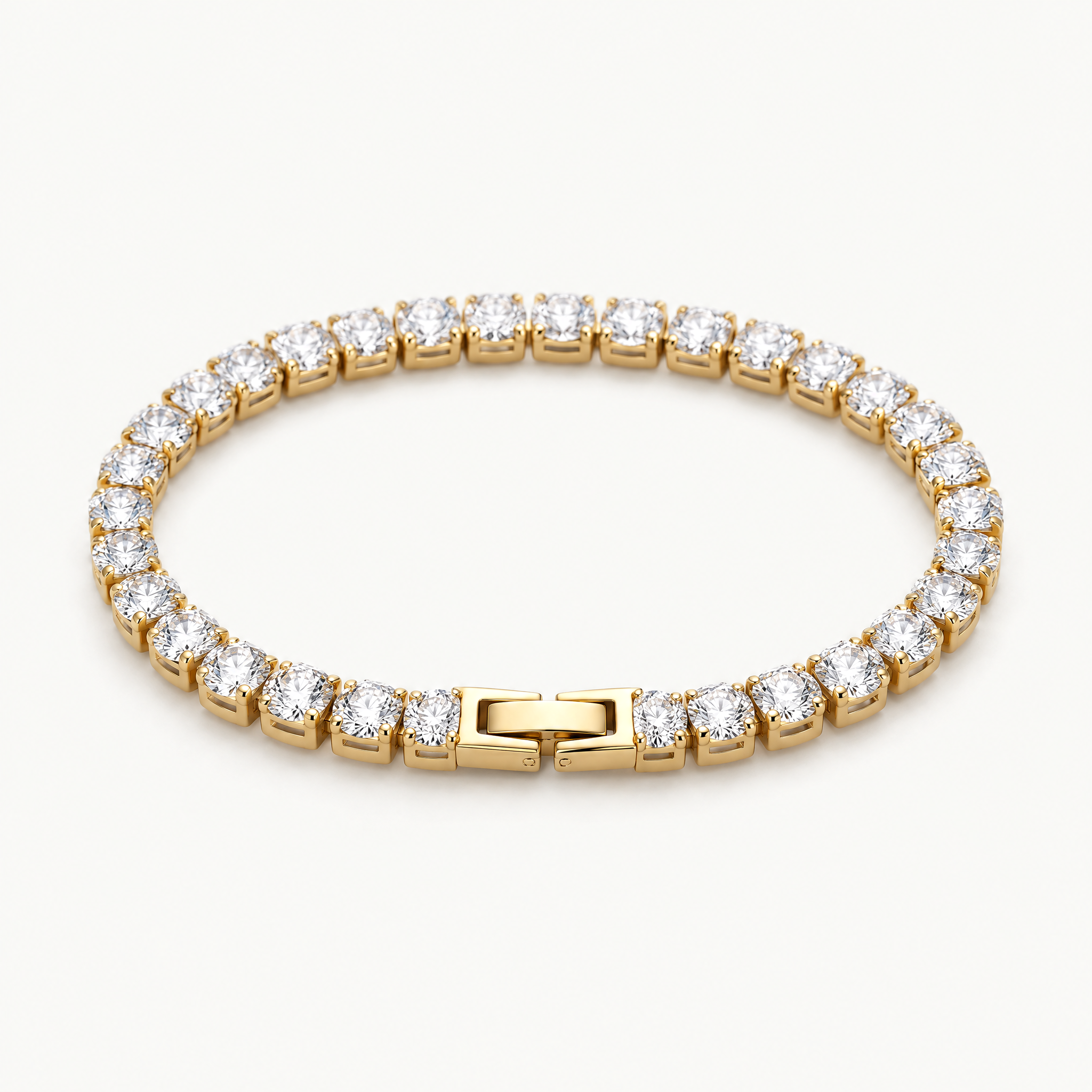 Gold-tone cubic zirconia tennis bracelet with box clasp, angled view