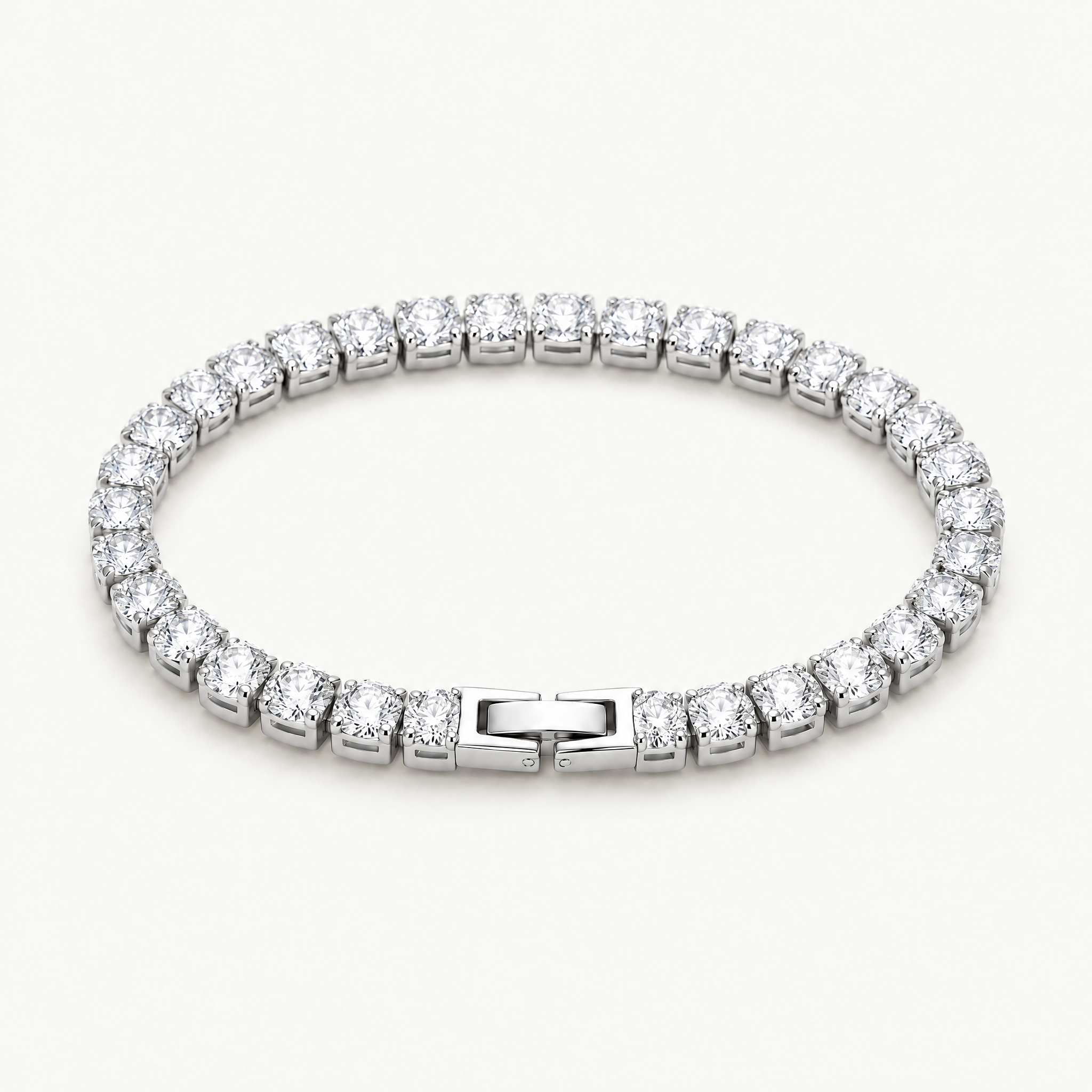 Silver-tone cubic zirconia tennis bracelet with box clasp, angled view