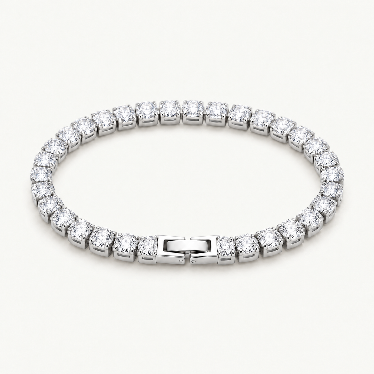 Silver-tone cubic zirconia tennis bracelet with box clasp, angled view