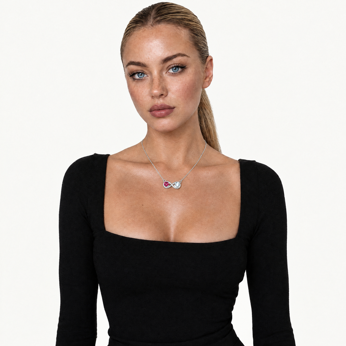 Model in a black top wearing the silver-tone infinity birthstone necklace