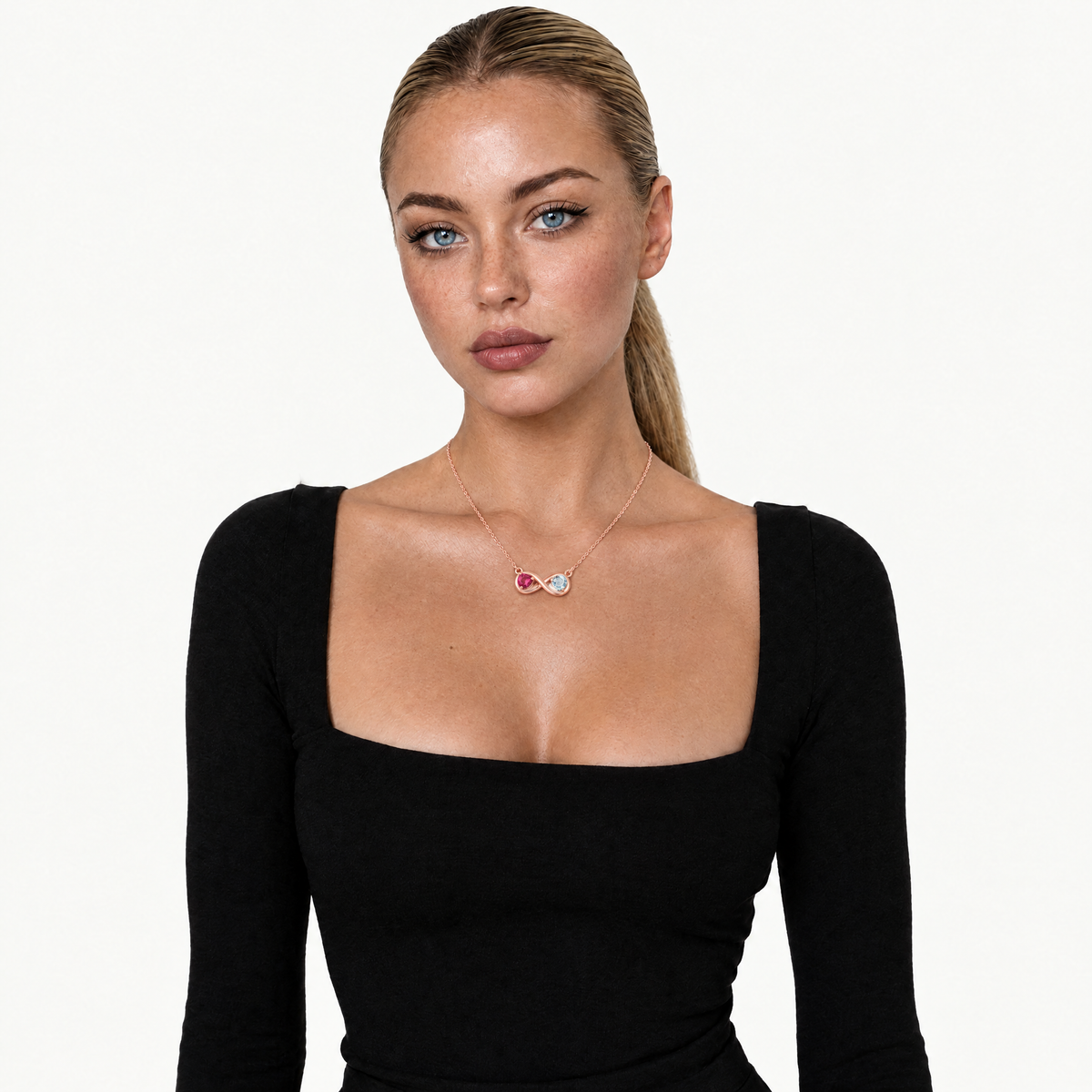 Model in a black top wearing the rose gold-tone infinity birthstone necklace