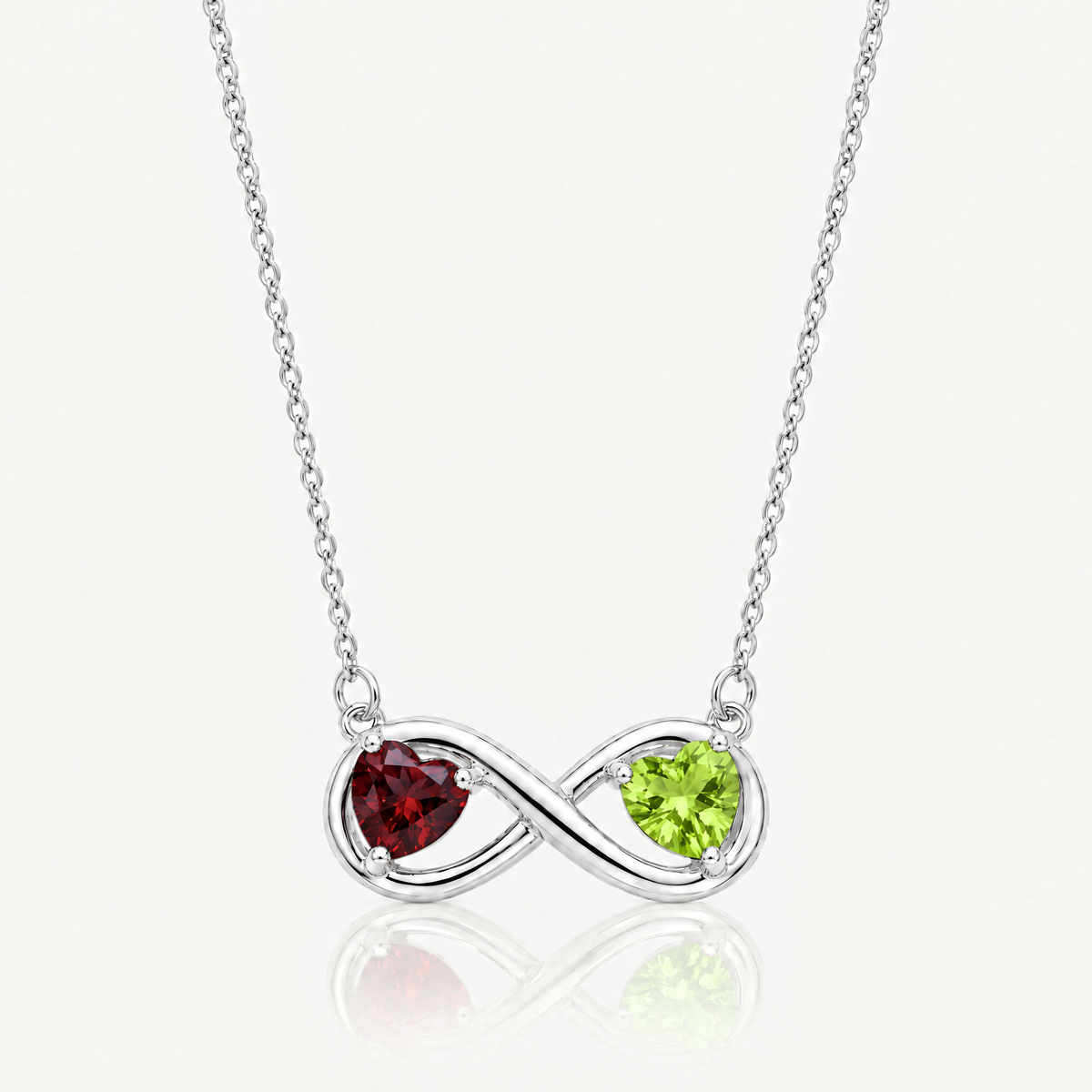 Silver-tone infinity necklace with garnet red and peridot green birthstone hearts