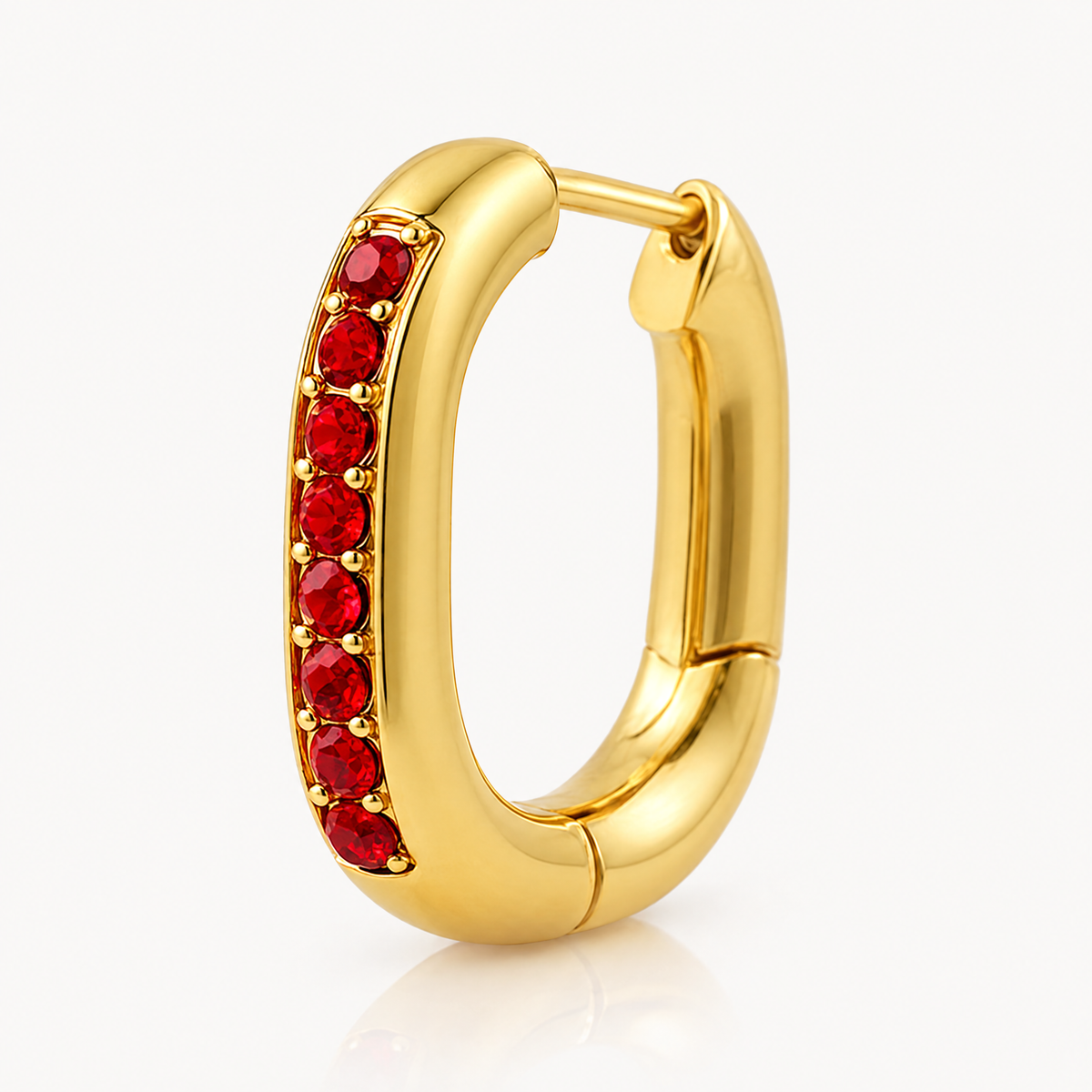 Single oval huggie hoop with red stones, hinged closure open